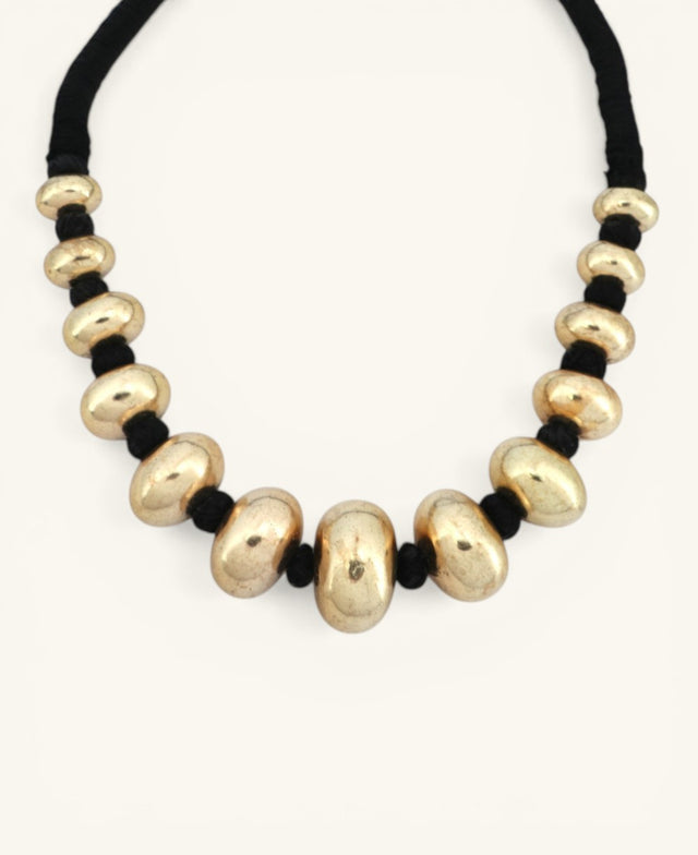 hampagne gold chunky bead choker necklace on black cord