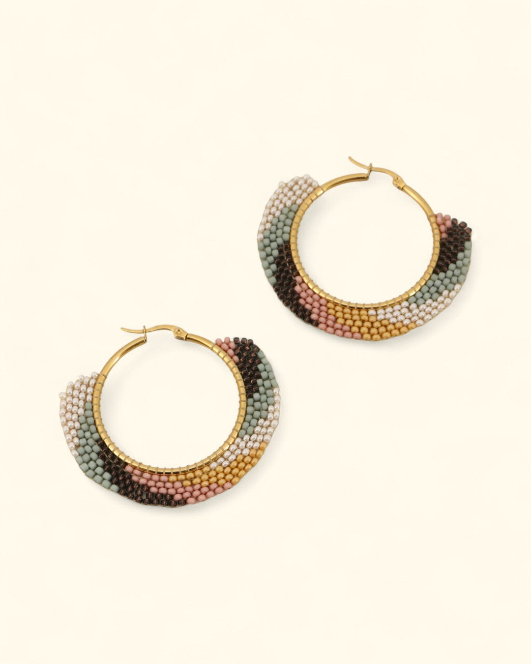 Earth-tone beaded hoop earrings handmade in Guatemala