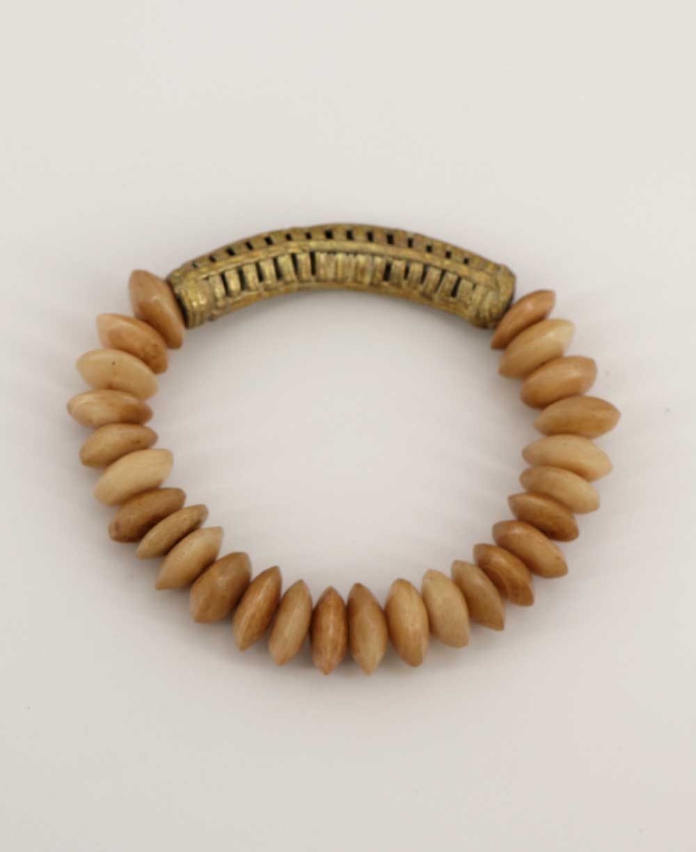 Beige clay bead bracelet with brass detail