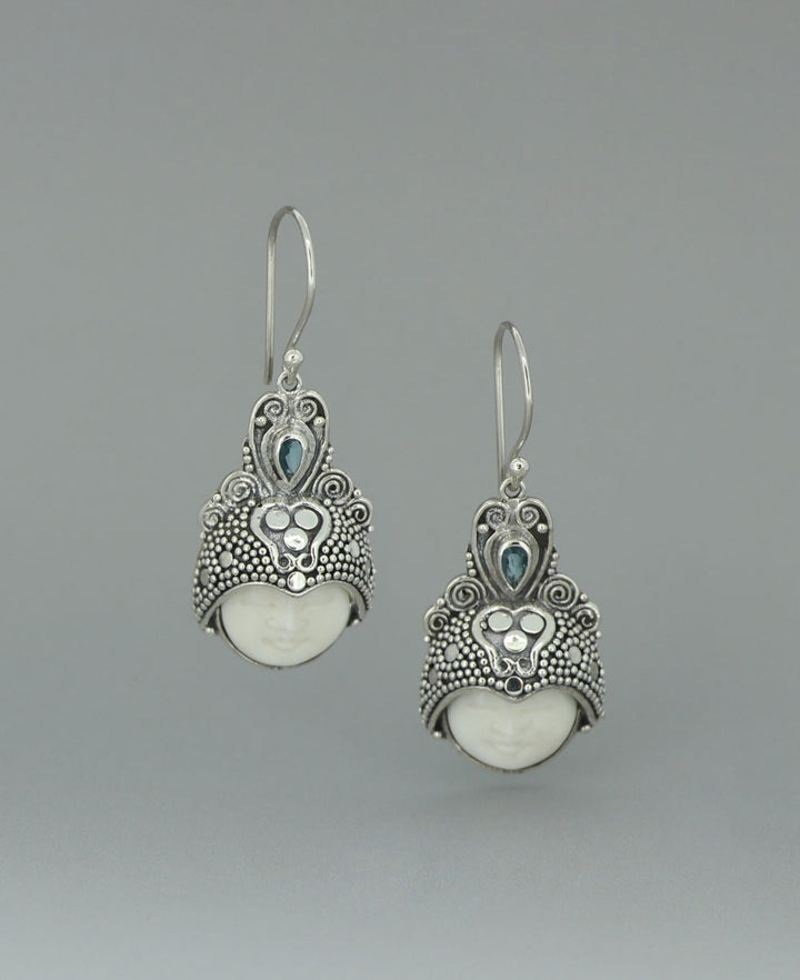 Full view of Sterling Silver Balinese Goddess Face Earrings highlighting the intricate filigree work and cool Blue Topaz