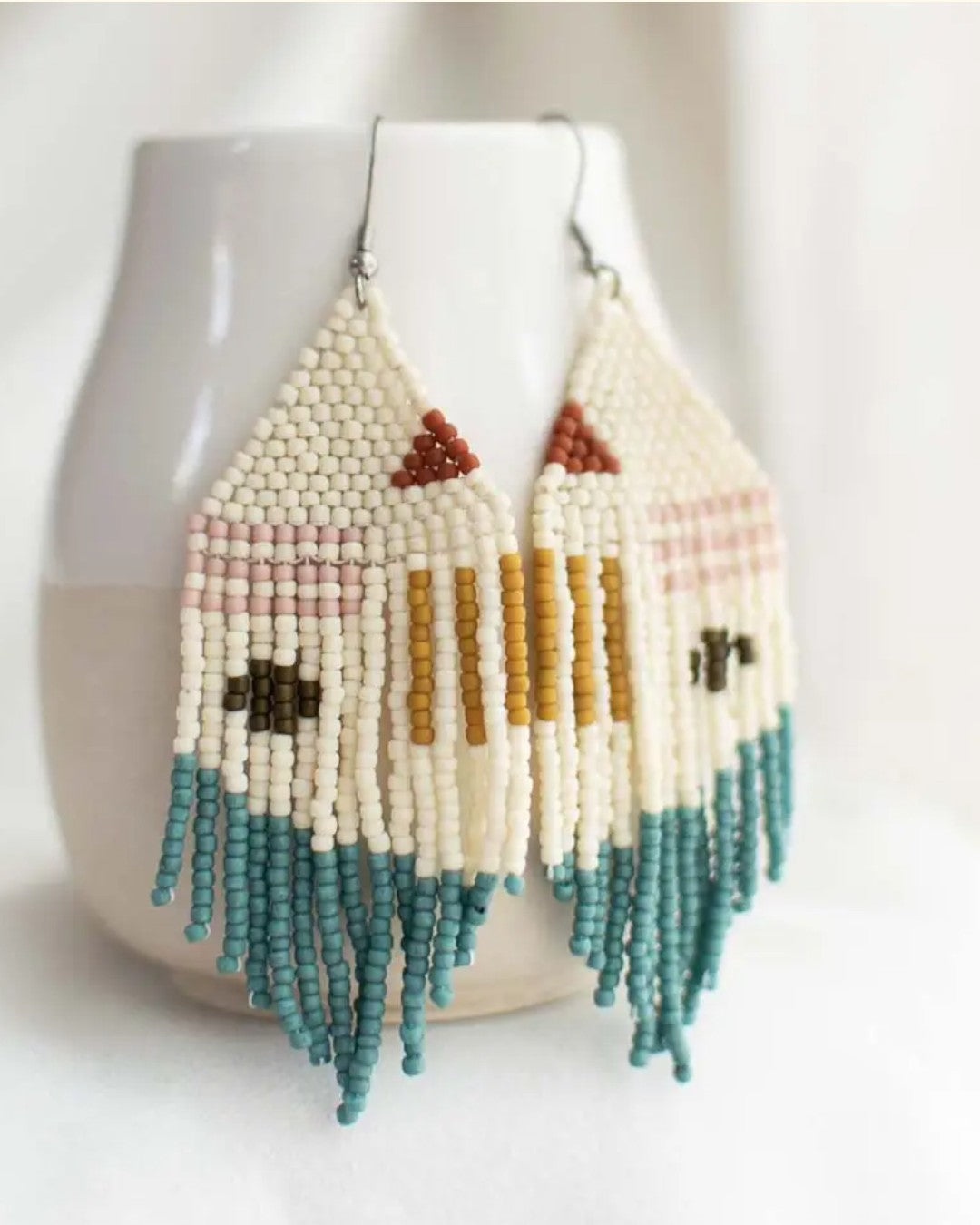 Beaded earrings with geometric patterns on a white background