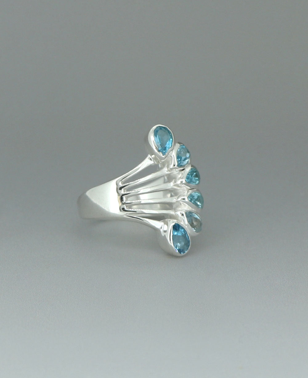 Elegant Blue Topaz Teardrop Ring in Silver