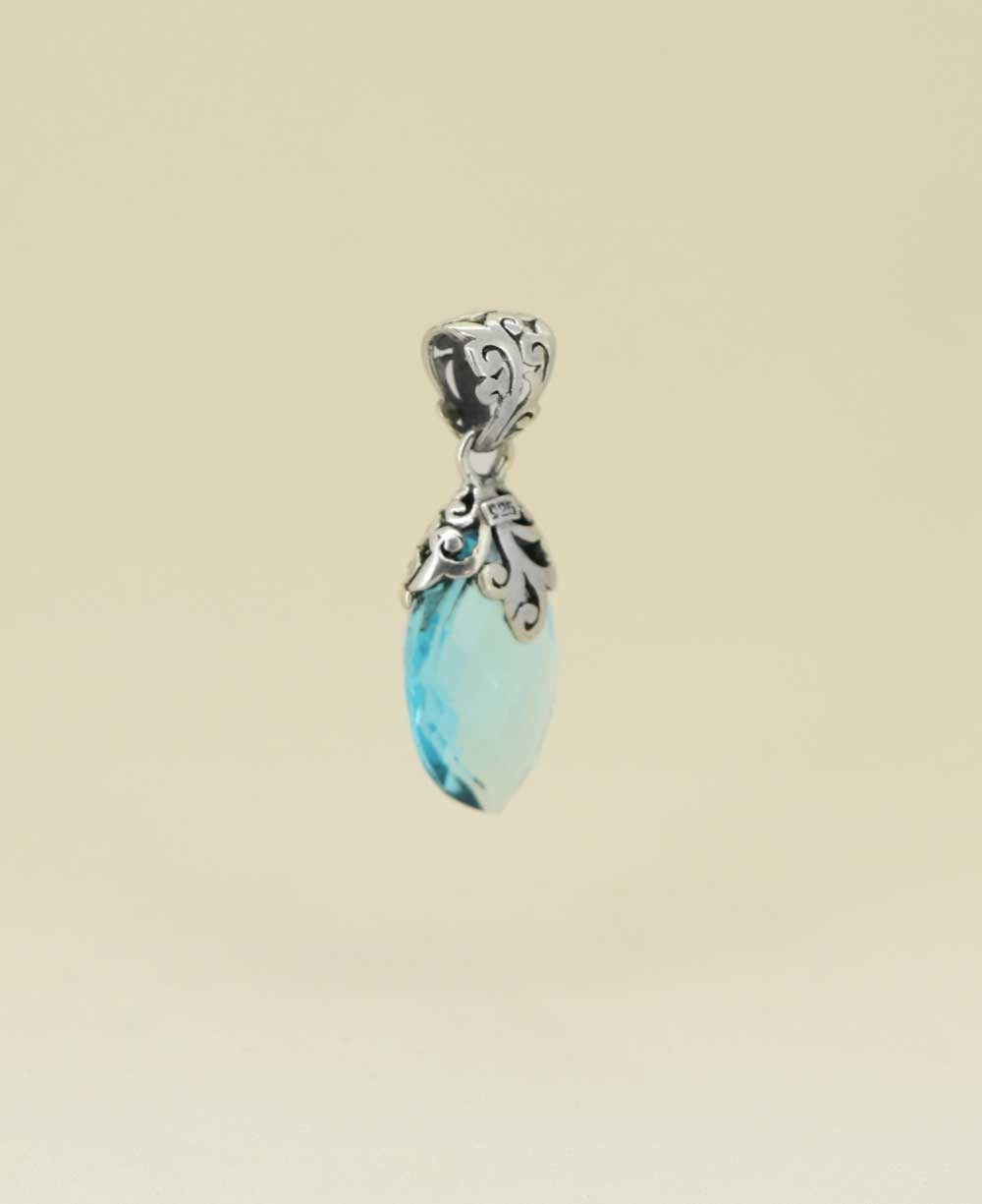 Almond-shaped-blue-topaz-pendant-with-floral-bail