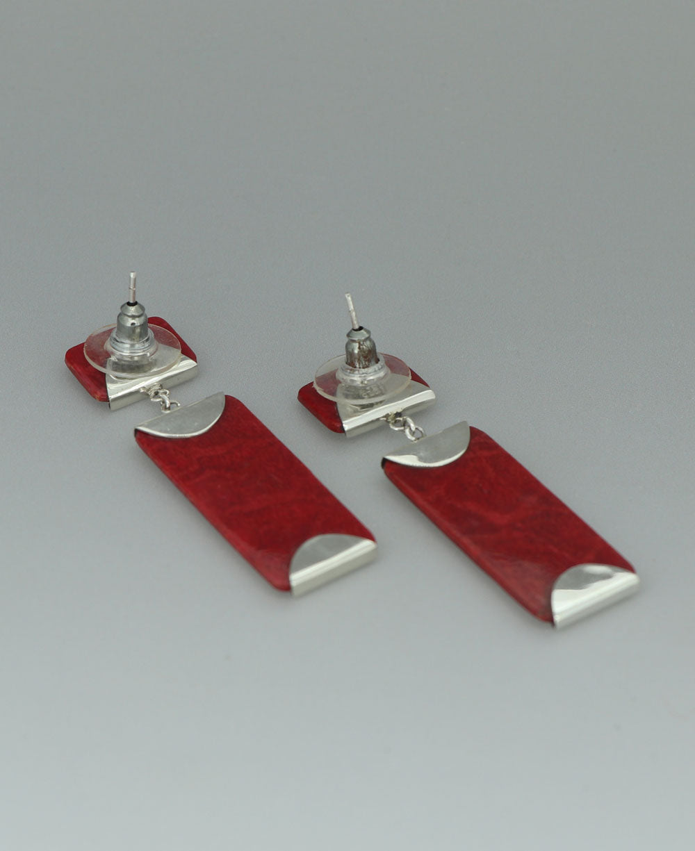 Sterling silver Red Coral earrings, emphasizing the modern design and vibrant color of the coral