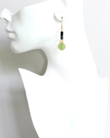 Modern artisan earrings with stacked shapes and textures