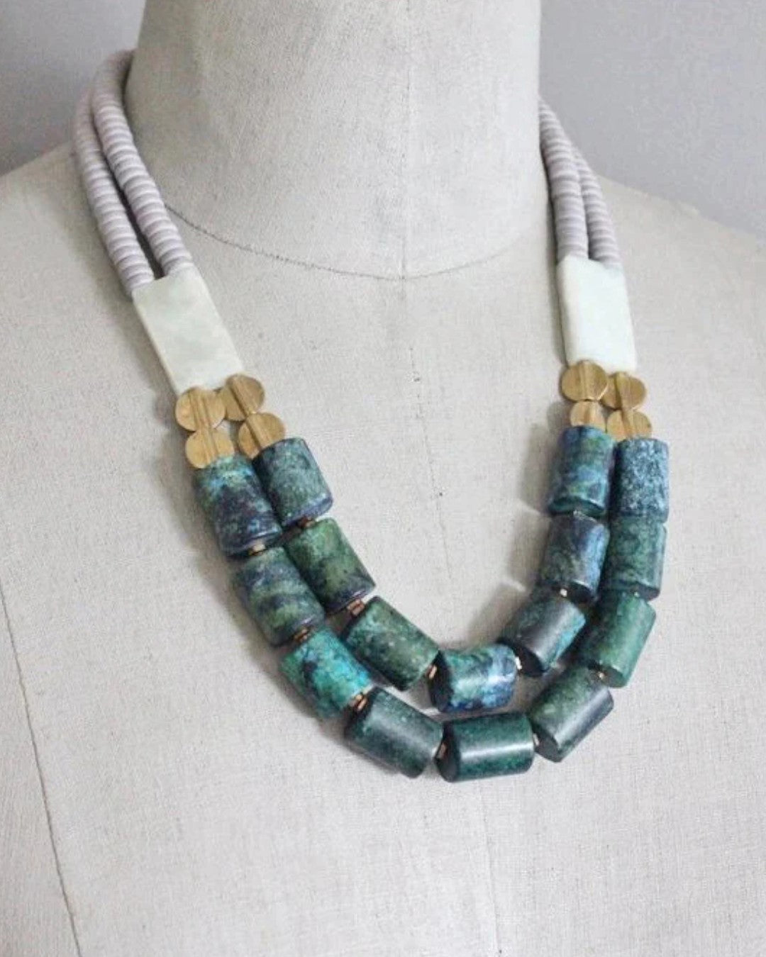Statement beaded necklace in teal and olive tones