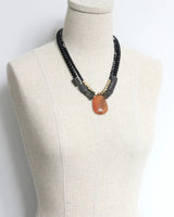 USA-made necklace with faceted glass and brass details