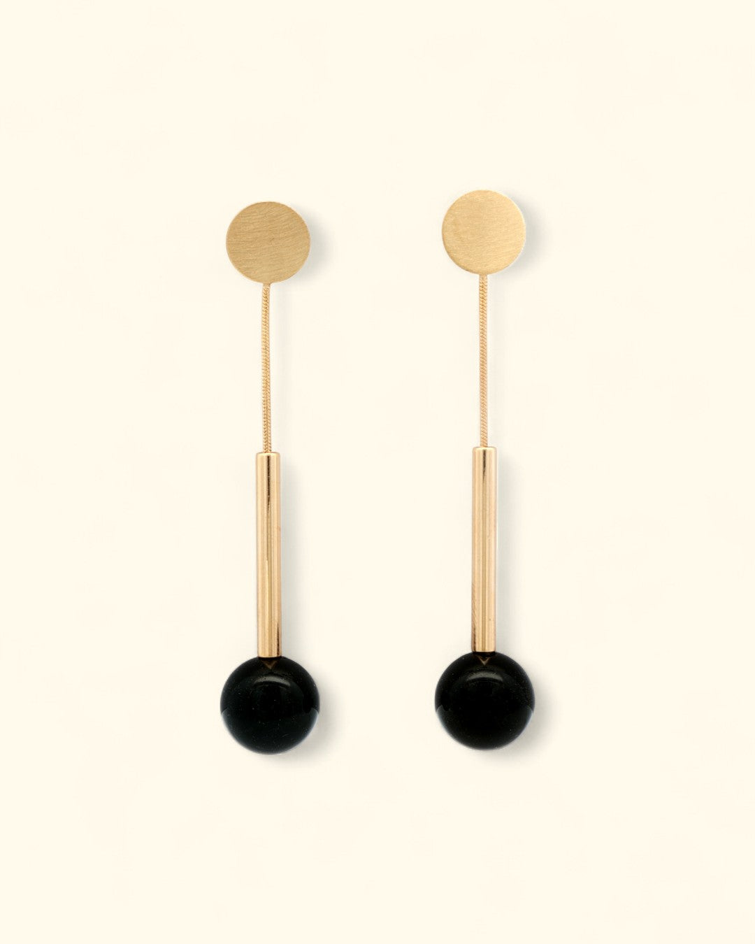 Black onyx and brushed gold linear earrings