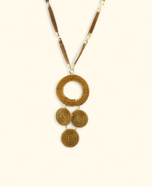 Handwoven necklace with cascading natural medallions