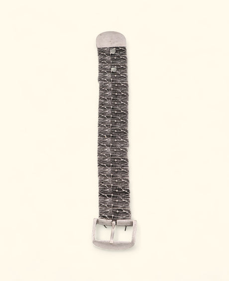 Pewter belt-inspired stretch bracelet on neutral background