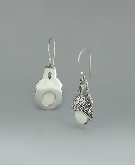 Sterling Silver Balinese Goddess Face Earrings on a light background, emphasizing the lustrous silver and tranquil aura of the design