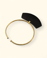 Curved horn pendant necklace on brass collar
