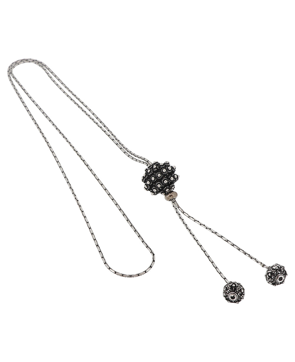 Adjustable length silver lariat necklace featuring intricate floral details, handcrafted in Laos