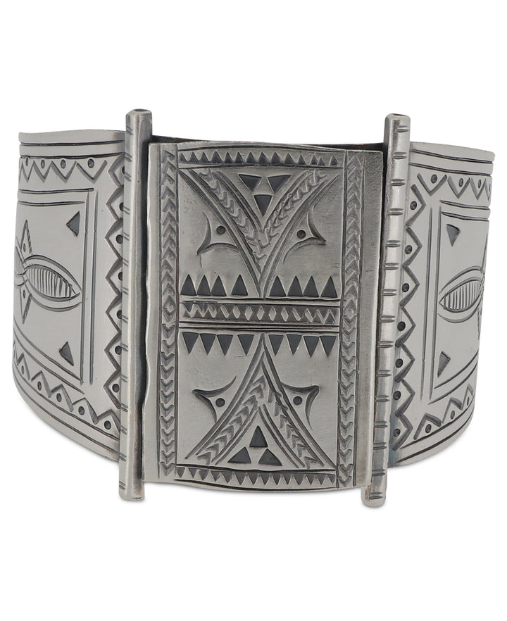 Artisanal Hilltribe silver cuff bracelet with intricate etchings.
