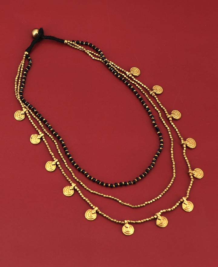 Unique three-strand necklace with brass discs