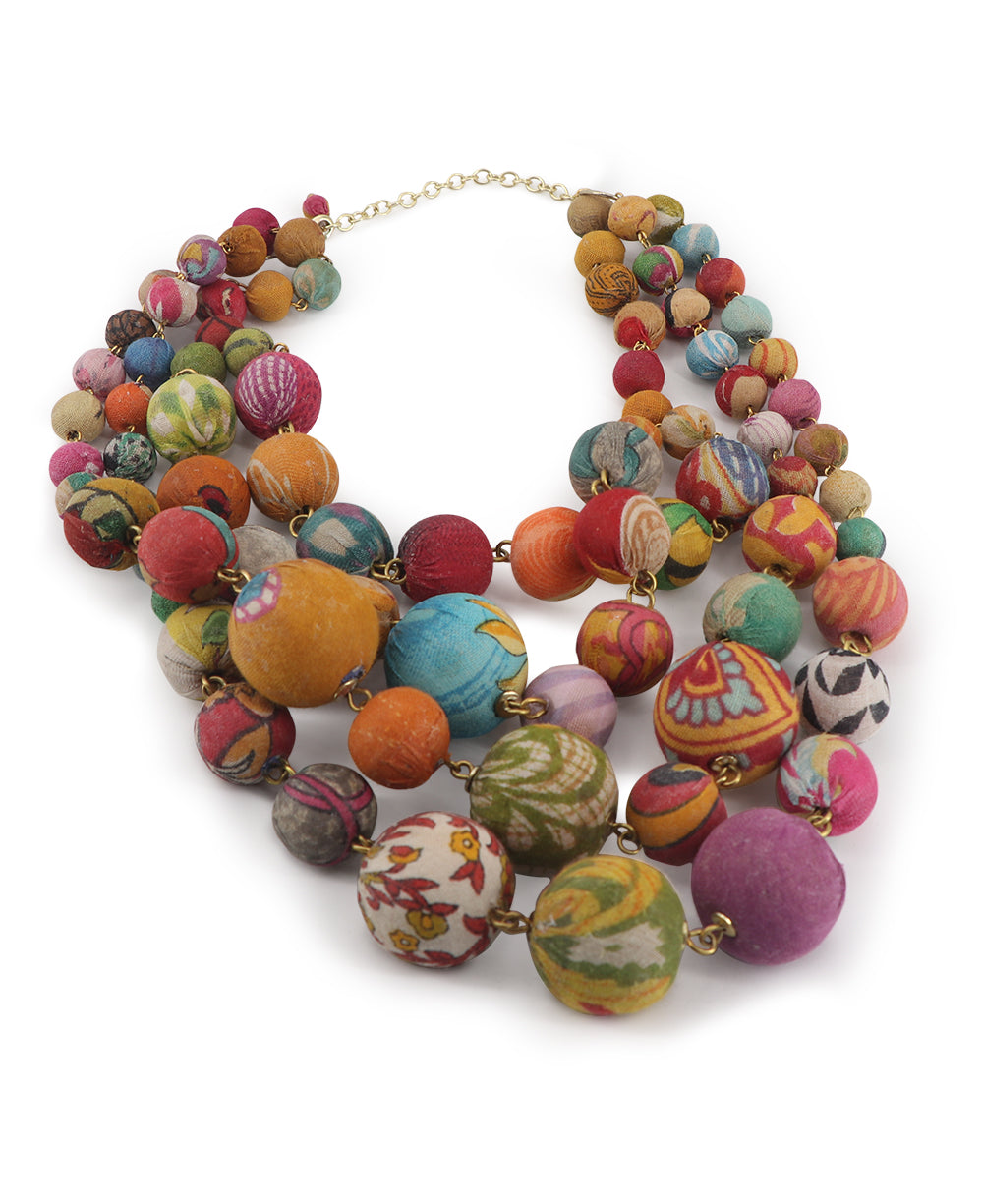 Necklace laid flat showcasing the multi-strand design