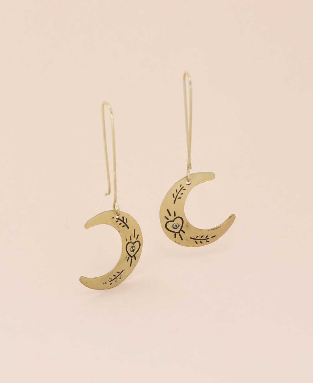 Close-up of Heart and Floral Engraved Moon Crescent Earrings