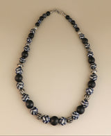 Hand-painted black and white ceramic bead necklace.