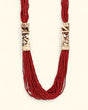 Red beaded necklace with elephant design carving