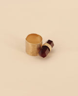Close-up view of the vibrant red onyx point set in a romantic rose gold plated brass ring