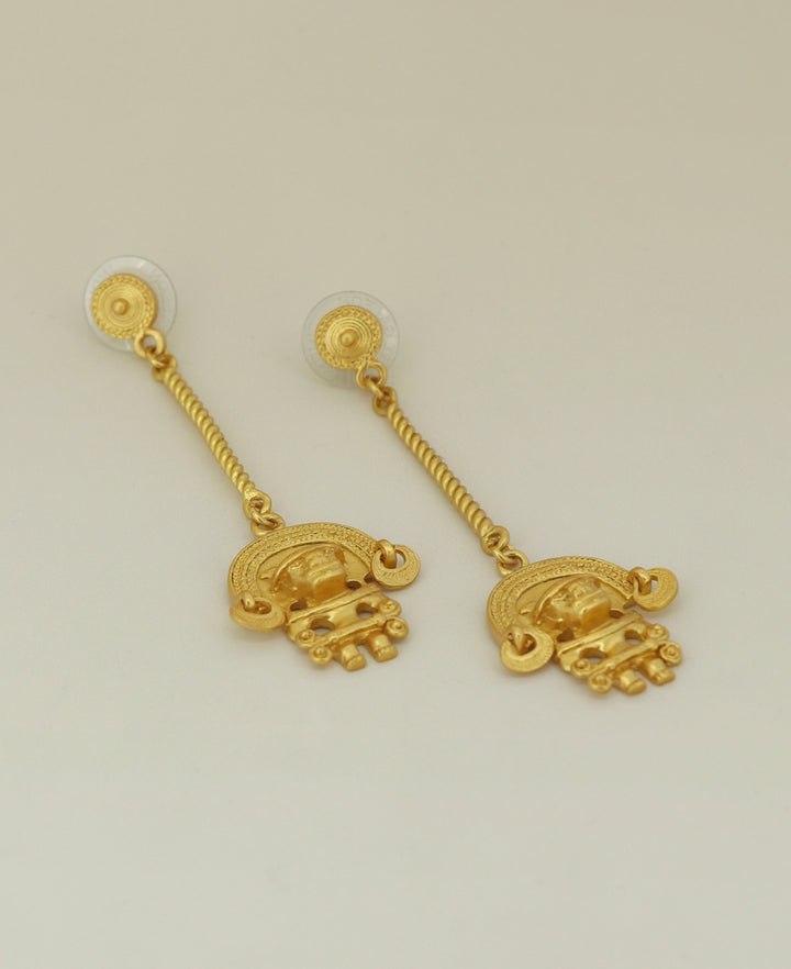 Side view of the Colombian-made Tairona symbol drop earrings