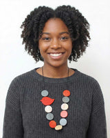 Adjustable wood bead necklace with red robin accent