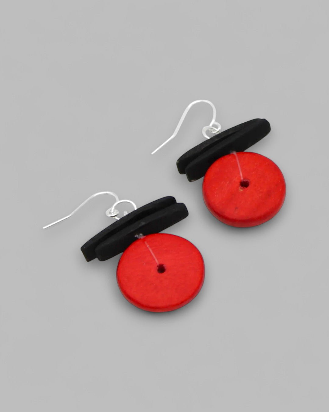 Handmade wooden earrings with bold red circular discs