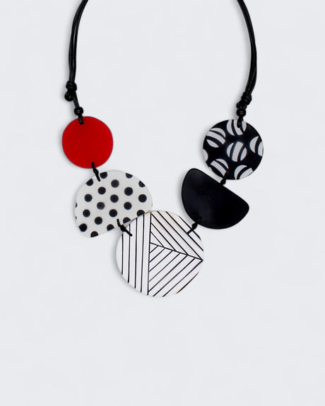 Black, white, and red resin bead necklace with bold patterns