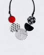Black, white, and red resin bead necklace with bold patterns