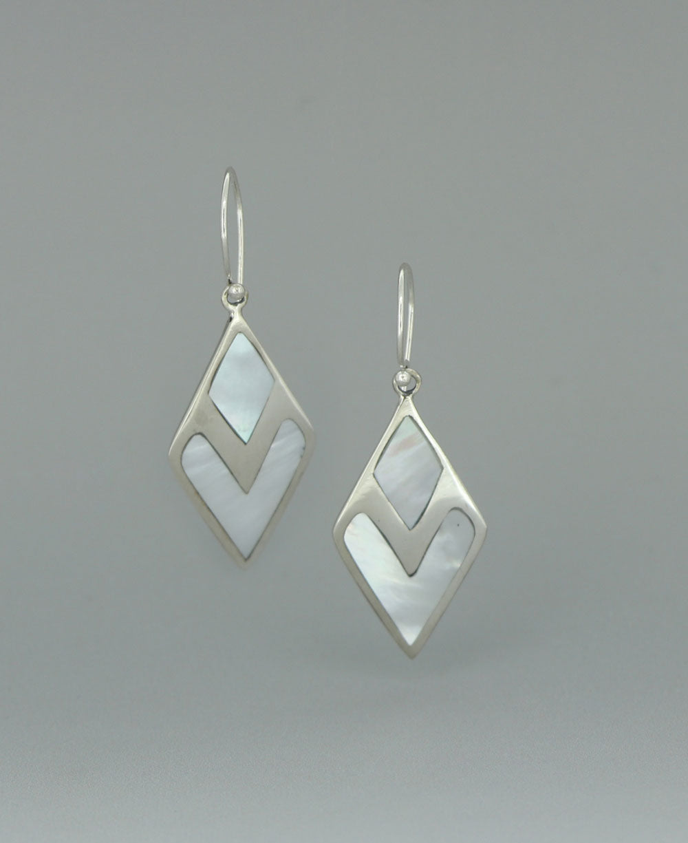 Full view of the sterling silver Mother of Pearl earrings against a light background, showcasing the geometric design and luminous shell inlay