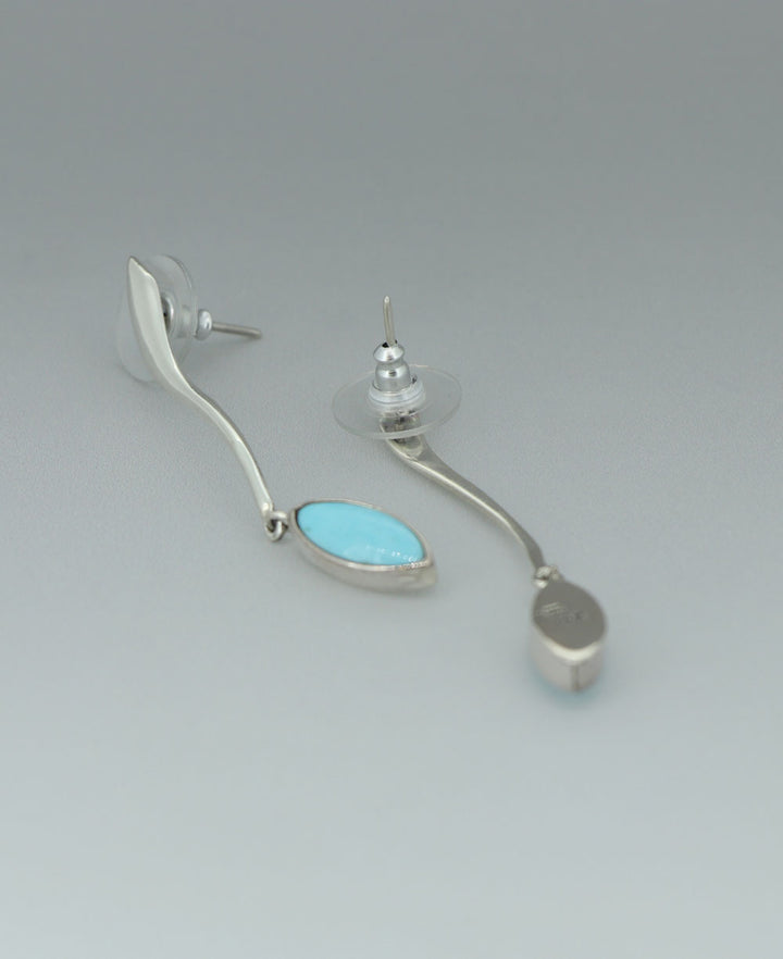 Full view of the sterling silver Genuine Turquoise earrings against a light background, showcasing the sleek silver bar and vibrant turquoise