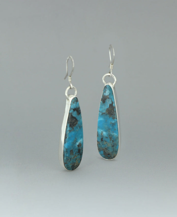 ull view of the sterling silver Genuine Turquoise earrings against a light background, emphasizing the vibrant Kingman turquoise
