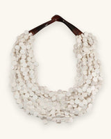 Cultural Elements soft white wood disc necklace with horn closure, twisted strands, 20 inches.