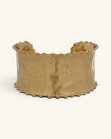 Beaded edge hand-hammered brass cuff bracelet on white background, front view showing hammered texture and beaded border