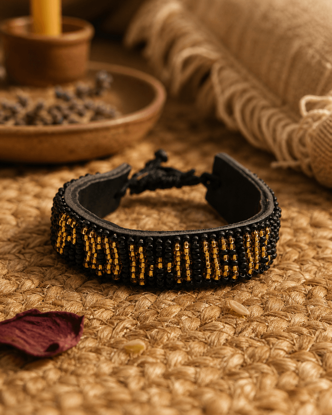 Handmade Kenyan beaded power bracelet on woven textile in meditation corner setting