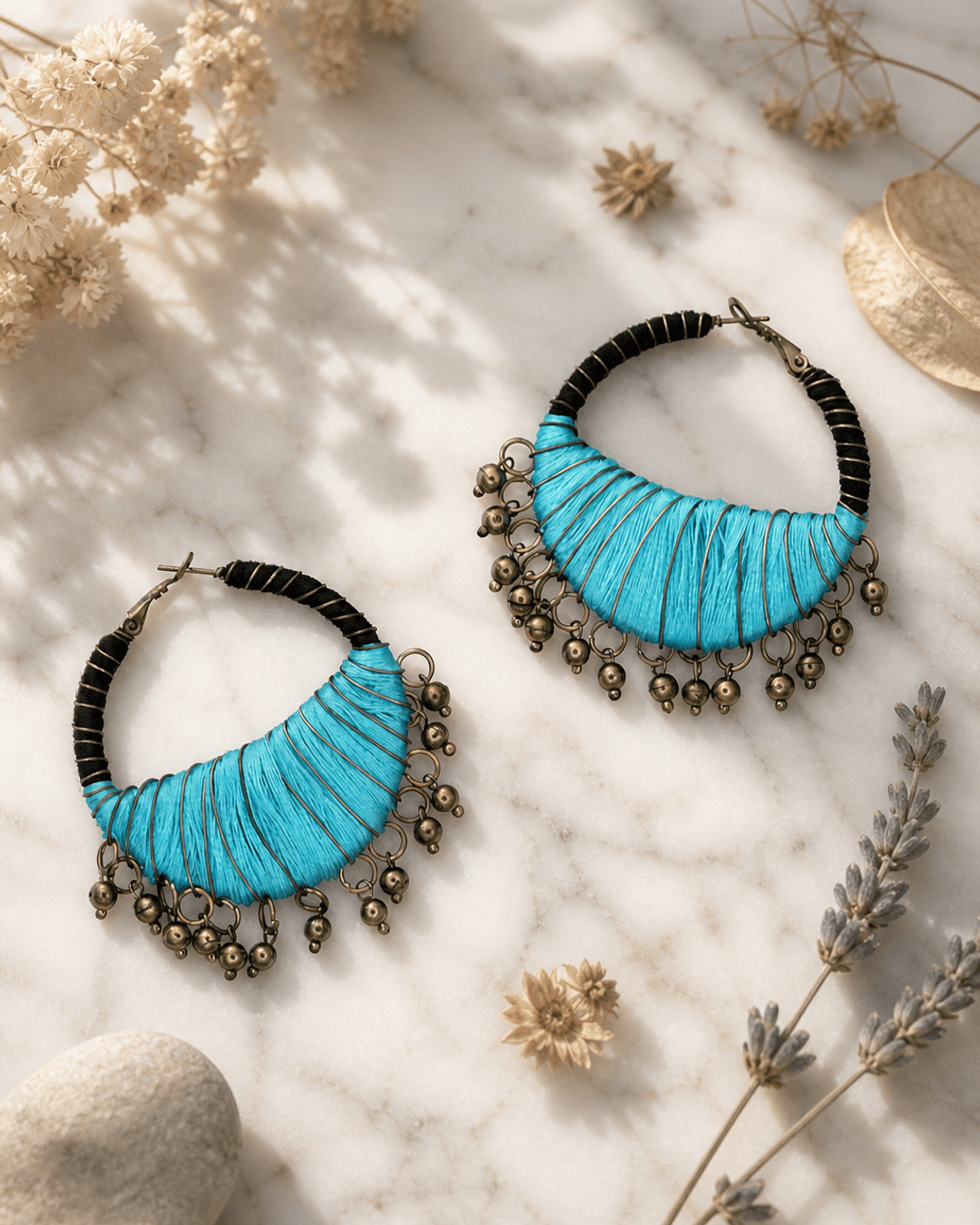 Black and Aqua Handcrafted Thread-Wrapped Hoop Earrings — earrings, editorial marble lifestyle photo