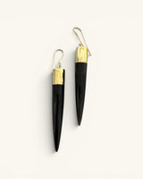 Kami black horn brass spike drop earrings pair on white background, front view showing gold wire hooks and brass caps above spikes