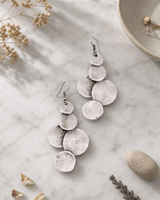 Cascade Textured Disc Drop Earrings — earrings, editorial marble lifestyle photo