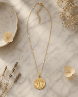 Celestial Tree of Life Gold Plated Necklace — necklaces, editorial marble lifestyle photo