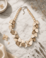 Chunky Wooden Bead Necklace with Triangular Accents — necklaces, editorial marble lifestyle photo