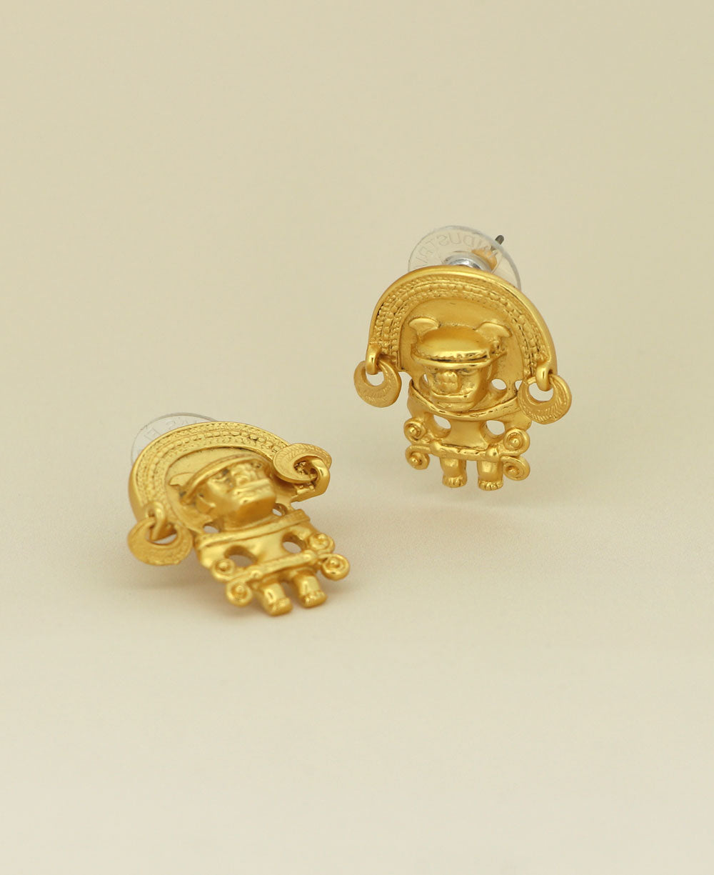 Tairona Symbol Earrings on a light background, emphasizing the detailed symbol