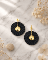 Colombian Artisanal Gilded Iraca Palm Earrings — earrings, editorial marble lifestyle photo