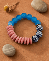 Chinoiserie beaded bracelet with colorful glass and ceramic beads displayed in a serene meditation corner setting