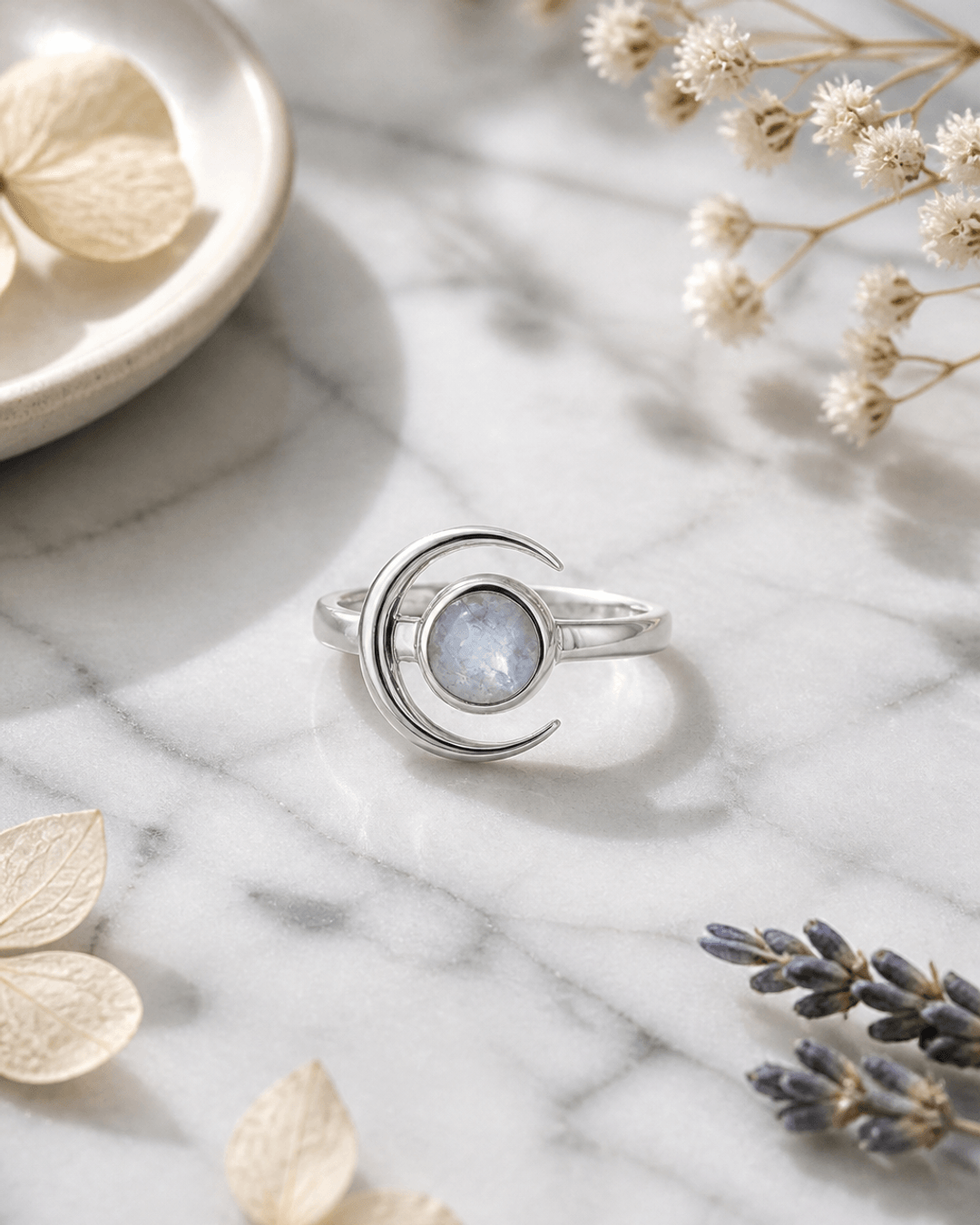 Crescent Moon Sterling Silver Rainbow Moonstone Ring — rings, editorial marble lifestyle photo