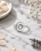 Crescent Moon Sterling Silver Rainbow Moonstone Ring — rings, editorial marble lifestyle photo