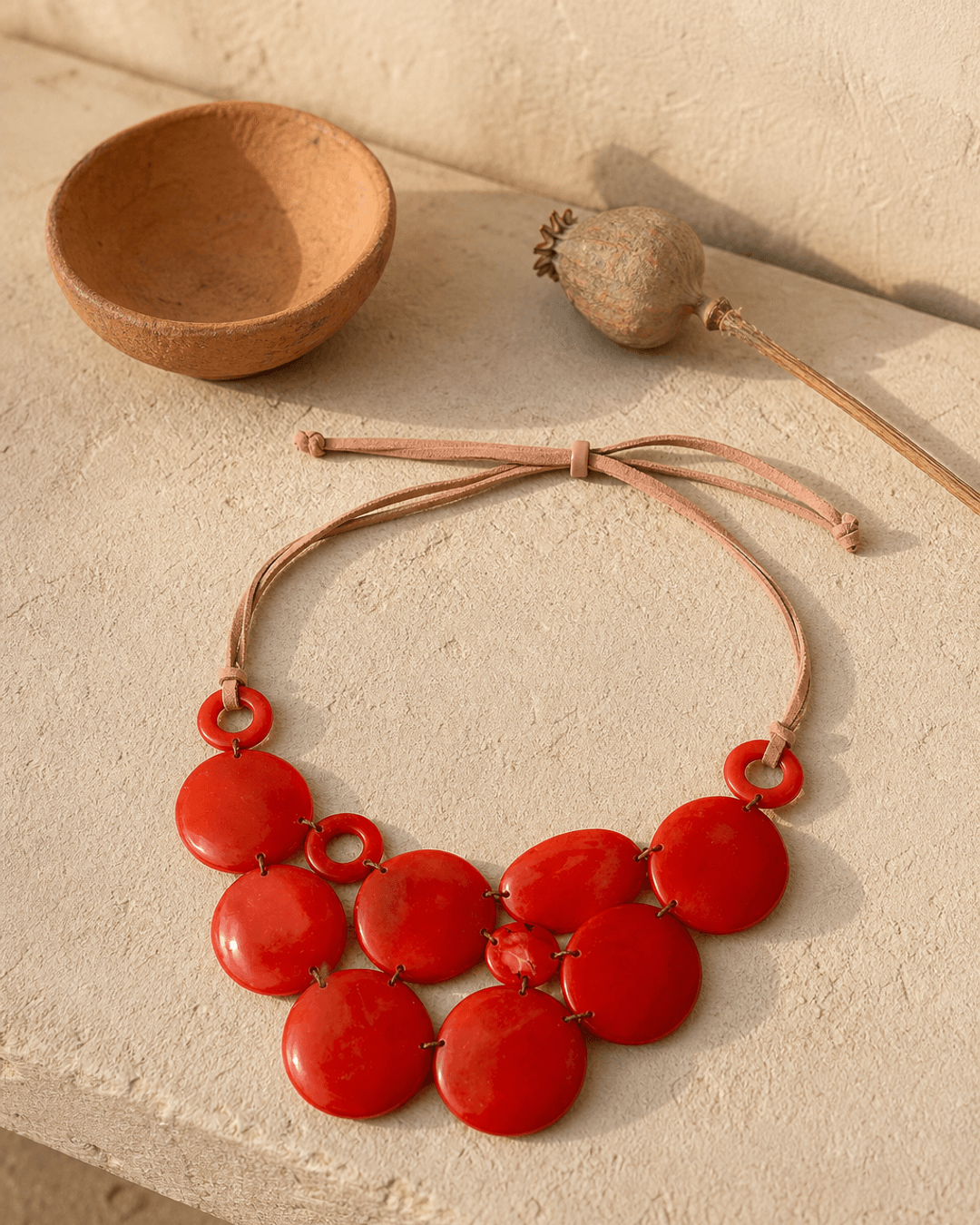 Crimson Radiance Tagua Necklace – Ecuador — necklaces, editorial plaster shadow lifestyle photo