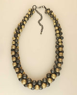 Cultural Elements gold and gunmetal-tone layered statement necklace with chunky beads and adjustable chain.