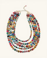 Cultural Elements multicolor five-strand layered necklace with textile beads and brass spacers.
