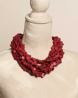 Cultural Elements twisted multi-strand red wood disc necklace with horn closure, 21 inches.