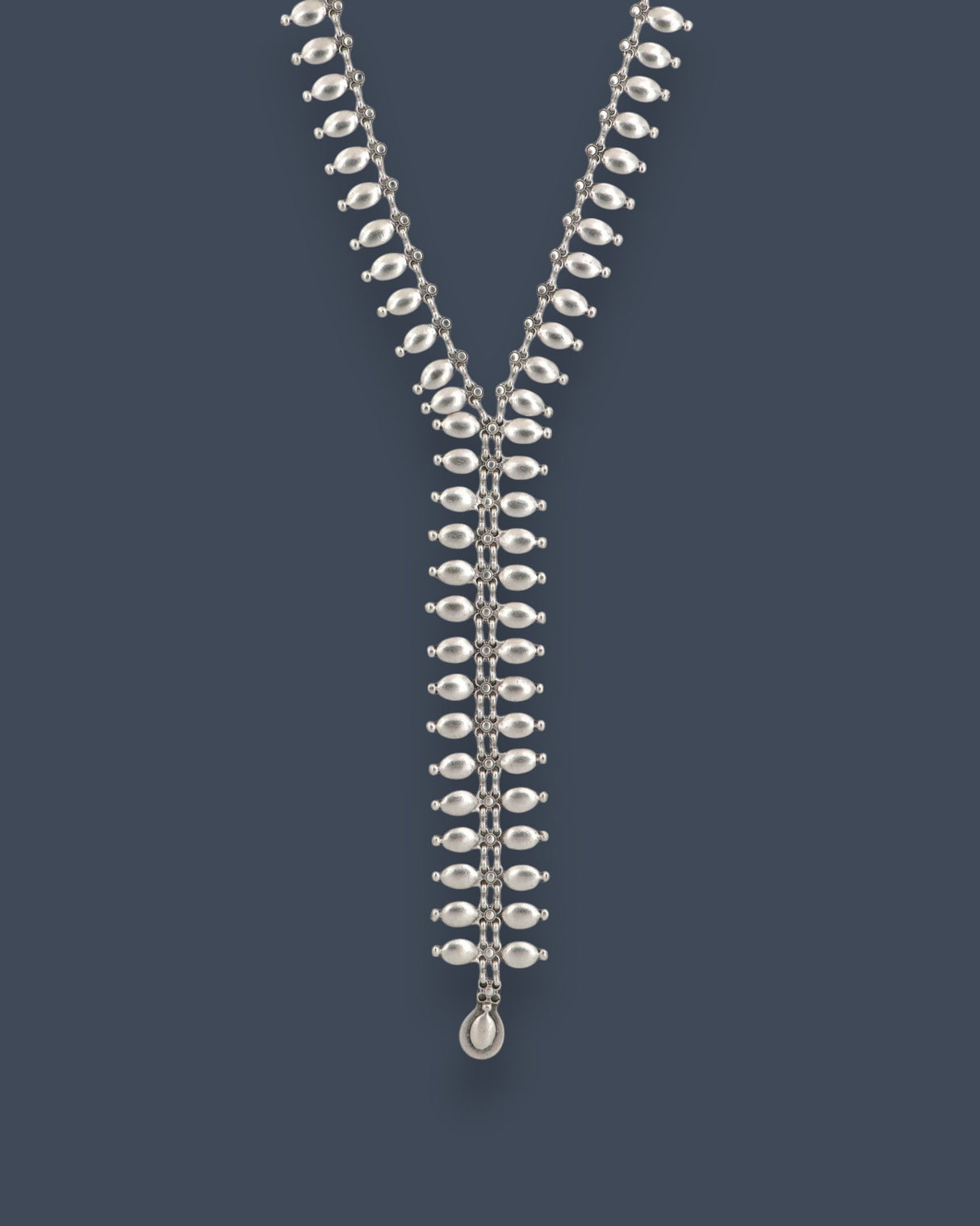 Cultural Elements silver-tone metal lariat necklace with oval and marquise-shaped links and a pendant drop.